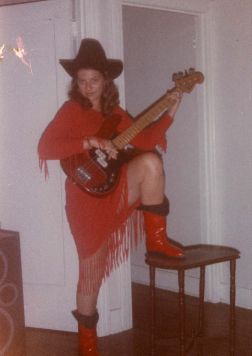 mel in red with red guitar